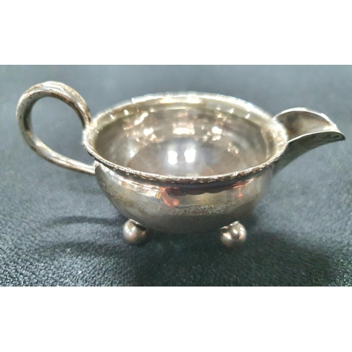27 - Small antique silver milk jug, marks rubbed with a silver hammered penny to its base,

37.5 grams
