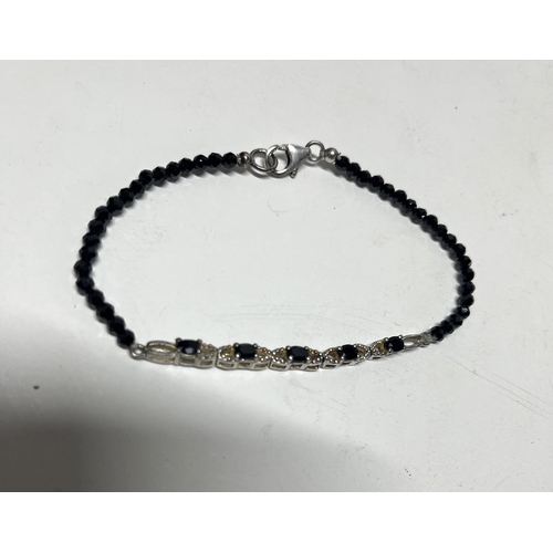 45 - Silver and onyx bracelet along with silver onyx ring and Cubic Zirconia earrings