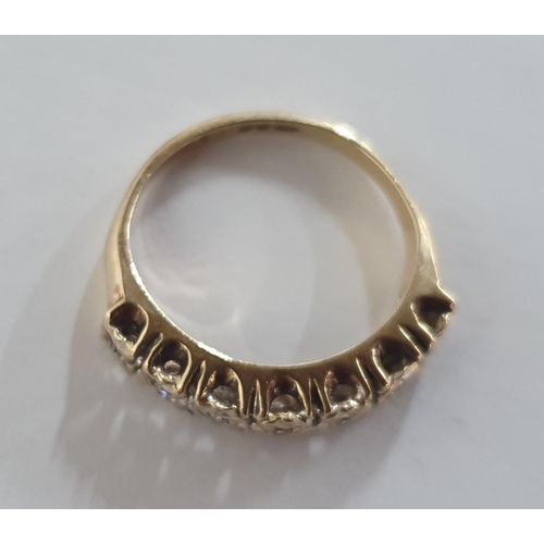 49 - Fully hallmarked 9ct yellow gold ring inset with 7 small round cut diamonds,

2.2 grams gross       ... 