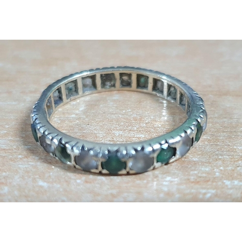 55 - Unmarked white metal eternity ring containing round cut emeralds and other clear semi-precious stone... 