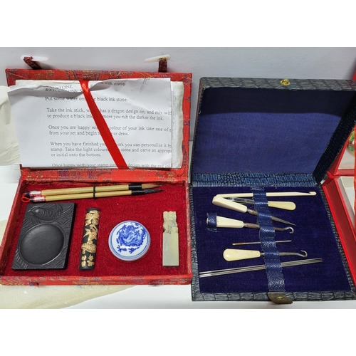 128 - Six boxed Chinese collectable sets including a Caligraphy set and hair comb set (6)