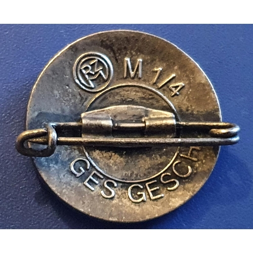 205 - A German SS enamel lapel badge marked RZM M 1/4 Ges Gesch verso