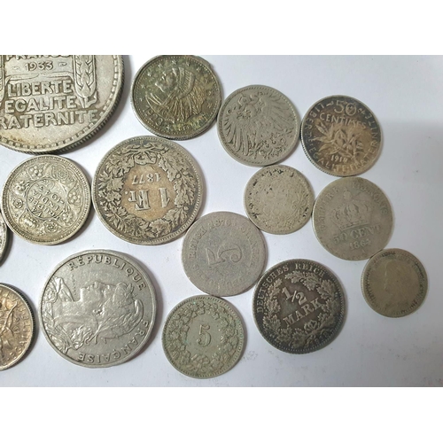 216 - Quantity of 19th & 20thC foreign coins, largely unsorted to include possibly a number of silver exam... 