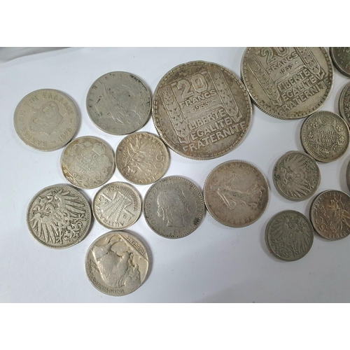 216 - Quantity of 19th & 20thC foreign coins, largely unsorted to include possibly a number of silver exam... 