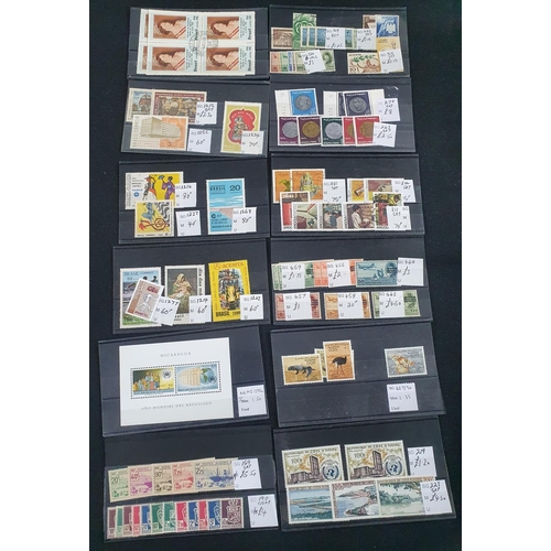 350 - Twelve small dealer cards containing Algeria, Various Africa, and Brazil etc, mint and unused unmoun... 