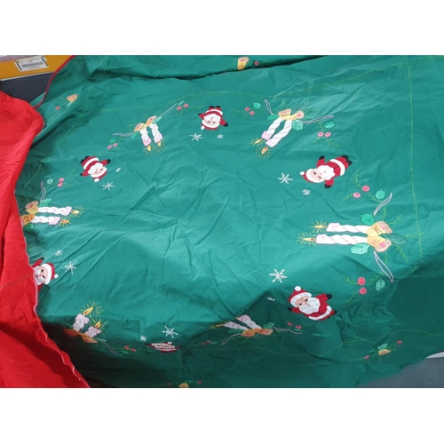 235 - Two embroidered table cloths including a Santa example (2)