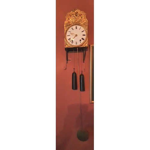 104 - Unmarked 19thC wall hanging clock in open form with circular enamel face and extensive pattered gilt... 