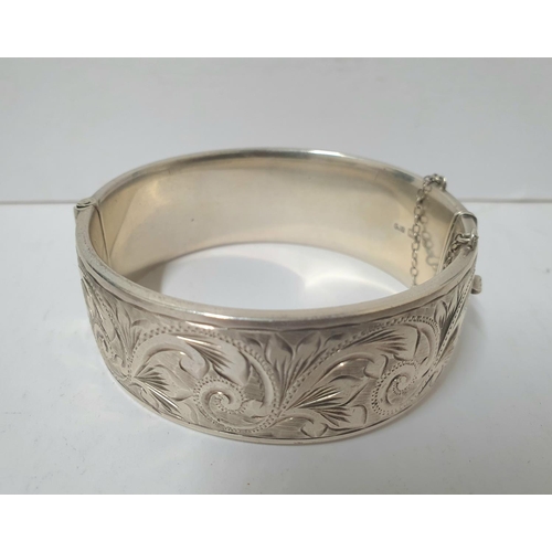 221 - Three heavy hallmarked silver bangles, the 2 engraved bangles both with Birmingham hallmarks, the ot... 