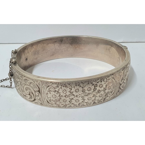 221 - Three heavy hallmarked silver bangles, the 2 engraved bangles both with Birmingham hallmarks, the ot... 