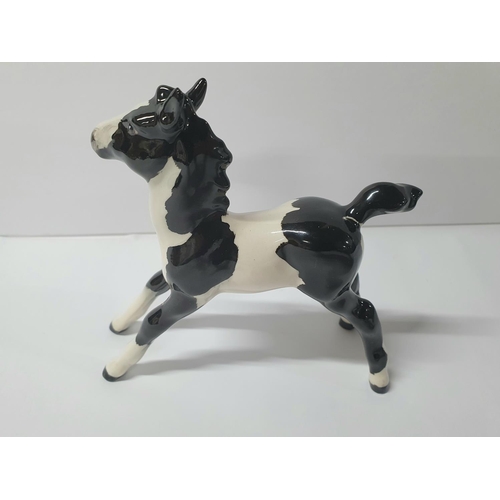 124 - RARE Beswick Pinto Piebald pony,

Approx 13cm long by 13cm tall

Please note - We cannot find this p... 