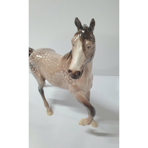 128 - Large rocking horse grey, prancing Arab horse, stamped Beswick

Approx 22cm long x 22cm high