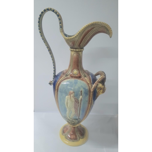 137 - Huge 19thC Majolica Ewer with Goats head and classical decoration in relief with high loop handle on... 