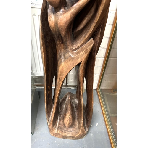 212 - Large Wooden sculpture of a mother and father with there 2 Children and expecting,

1.5m tall