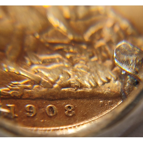 226 - A George IV 1908 full sovereign situated in a 9ct. yellow gold shank with George and the Dragon depi... 