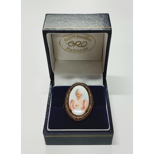 228 - A 9ct. rose gold ring with an oval ceramic female portrait insert

5.14 grams gross