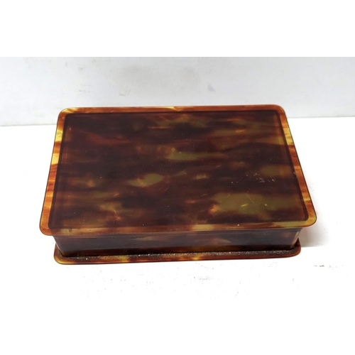 219 - Small antique tortoise shell box containing a quantity of antique glass eyes