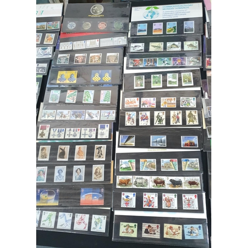 195 - Approx 110 GB QEII 1980s and 1990s stamp packs, high overall value (approx 110)