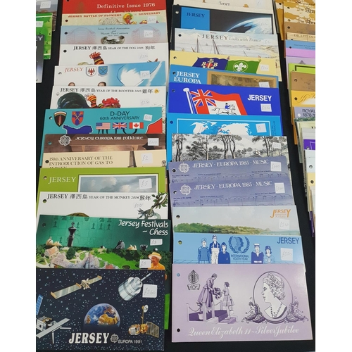 197 - Large collection of Jersey 1970s-2006 stamp packs, approx 130 together with 2 Guernsey examples (130... 