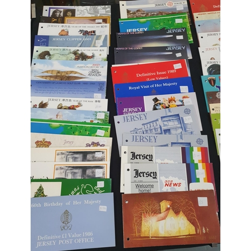 197 - Large collection of Jersey 1970s-2006 stamp packs, approx 130 together with 2 Guernsey examples (130... 