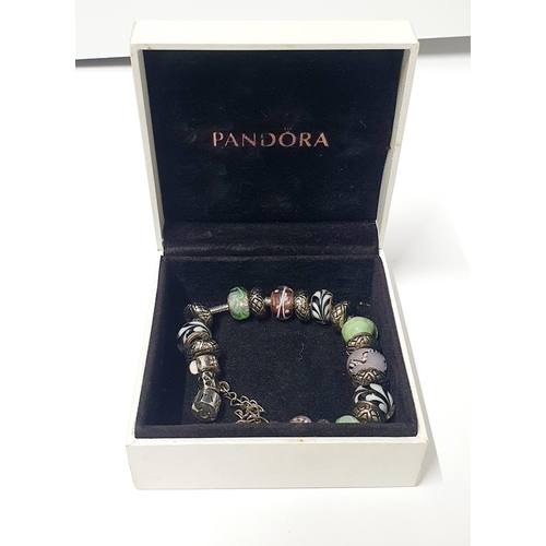 295 - Pandora bracelet along with numerous silver 925 Pandora charms and box