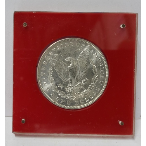 351 - Uncirculated 1887 silver dollar in perspex protective case