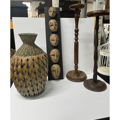 425 - Mid 20th c wooden standing ash trays along with wicker vase and wall plaque with carved wooden faces... 