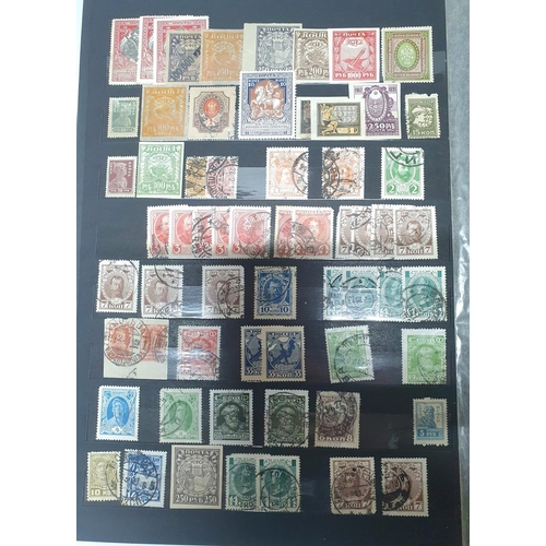 512 - Brown Stock book with a collection of Russia, approx 840 stamps, mainly used, 19thC coat of arms to ... 