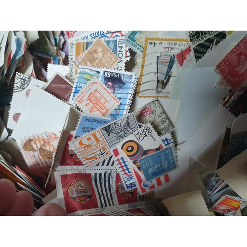 516 - Huge box full of unsorted loose stamps - approx 2.5 kilos