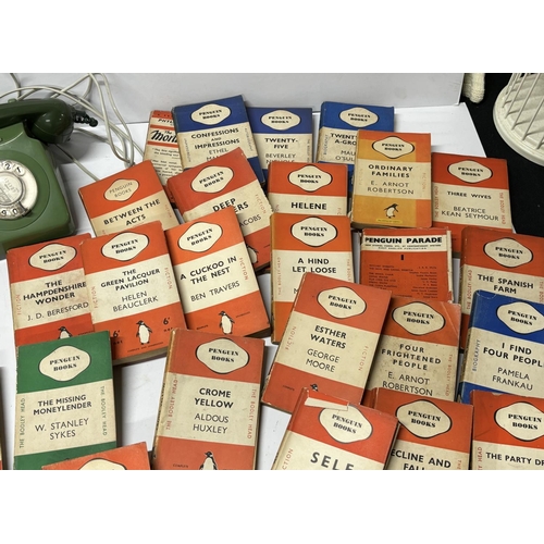 472 - Collection of penguin books and a phone