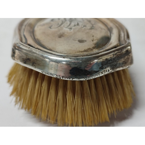 271 - A Silver vanity set comprising of a hand held mirror and brush (2)

465 grams gross