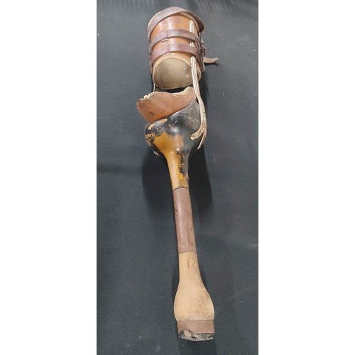 41 - Antique false leg in leather, wood and metal