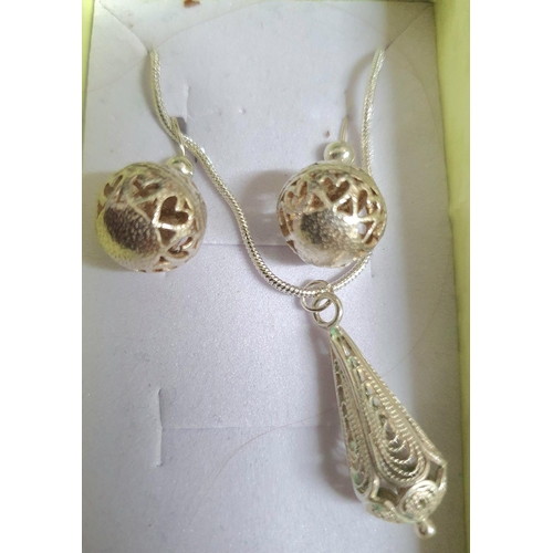 35 - Two silver necklaces' both with pendants and matching earrings and both in presentation boxes (2)