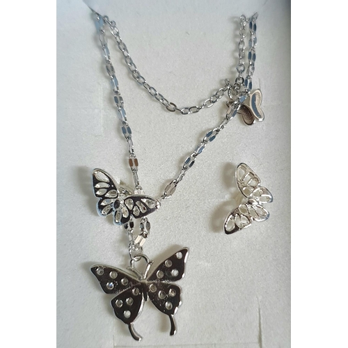 36 - Two silver necklaces' both with pendants and matching earrings and both in blue presentation boxes (... 