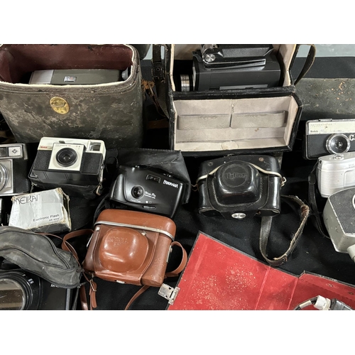 55 - Collection of old cameras and equipment including Halina and Kodak