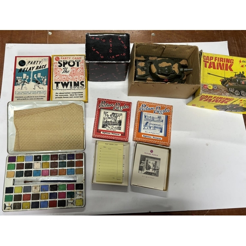 83 - Collection of old games together with a boxed 1970s Marx cap firing tank (Qty)