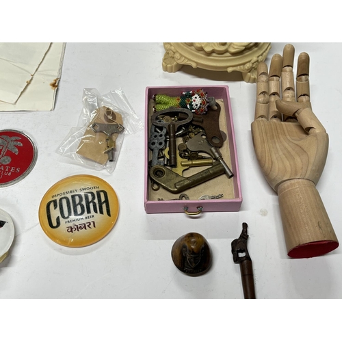 85 - Small box of misc including wooden hand with keys and stamps