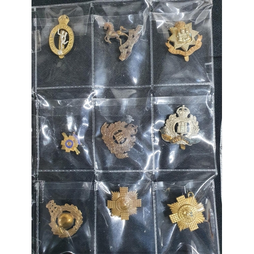 95 - Collection of approx 15 WWII era Briish army cap badges, lapel pin etc (15)