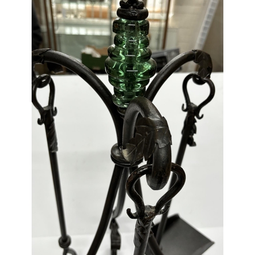 201 - Cast Iron fire poker set with green glass