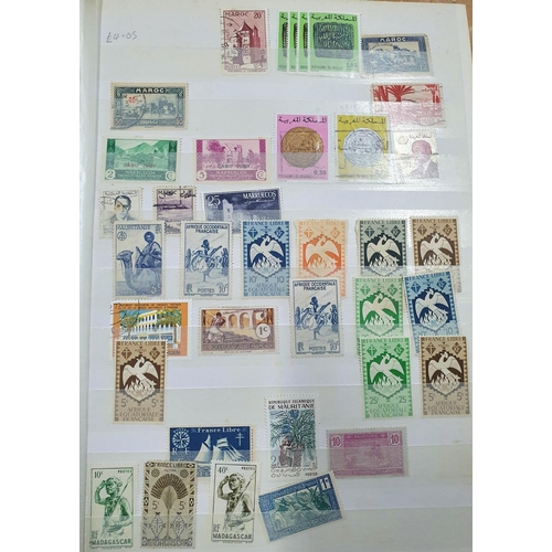 244 - Blue and green stock books both containing 20thC world mint and mainly used stamps, good section of ... 