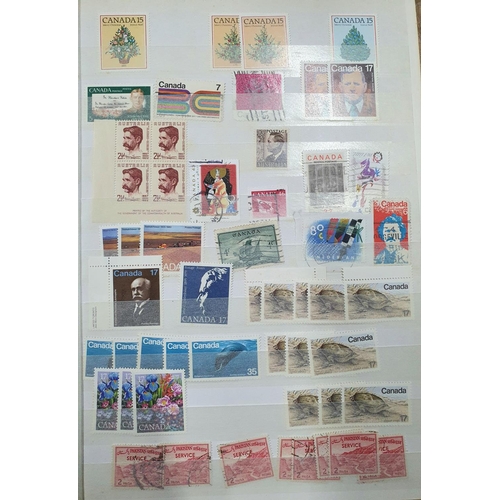 244 - Blue and green stock books both containing 20thC world mint and mainly used stamps, good section of ... 