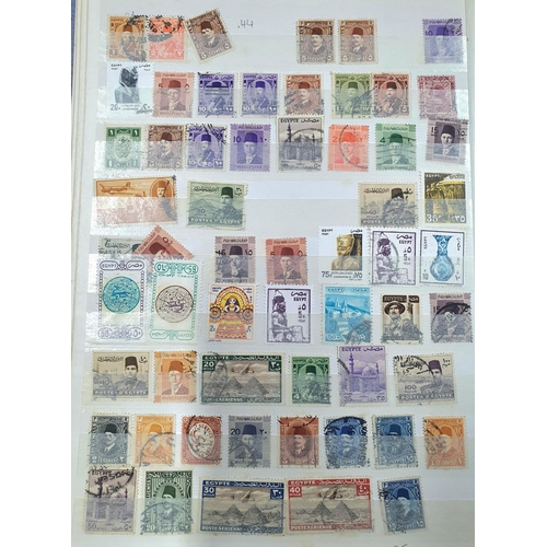 244 - Blue and green stock books both containing 20thC world mint and mainly used stamps, good section of ... 