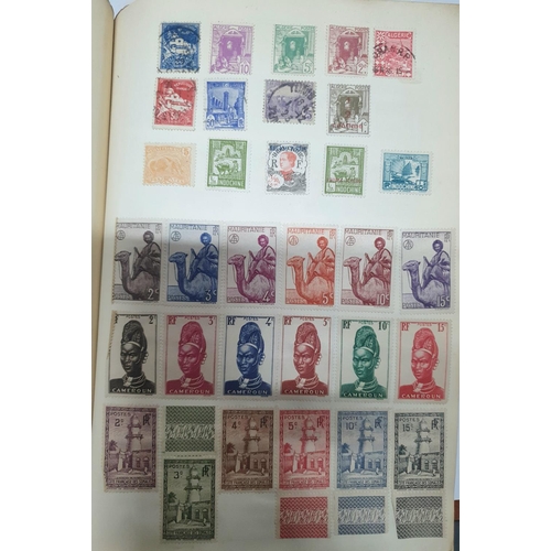 307 - Two old stamp albums containing a large quantity of world stamps including Canada, French Africa col... 