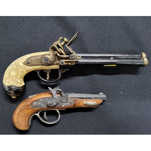 198 - Pair of Replica pistols one being a flintlock and the other a percussion cap (2)