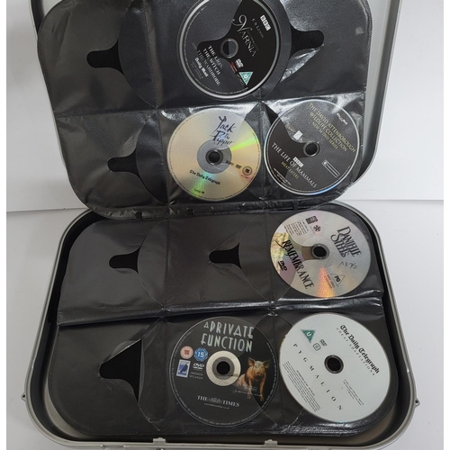 656 - DVD aluminum case carrier including some DVD's