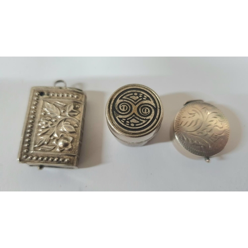 8 - Two small, unmarked silver pill boxes together with a similar large charm/pendant in the form of a b... 