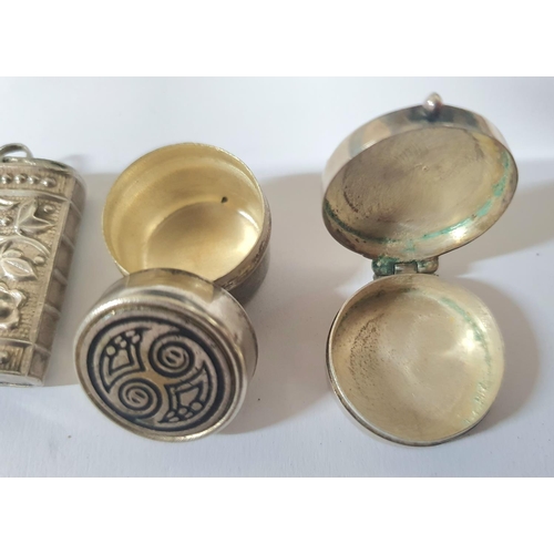 8 - Two small, unmarked silver pill boxes together with a similar large charm/pendant in the form of a b... 