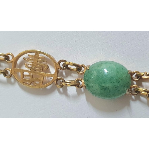 45 - Hong Kong spinach green jadeite and unmarked yellow metal mounted bracelet,

9.5 grams gross        ... 