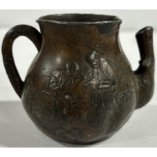 92 - Small Chinese possibly Bronze tea pot with designs on the side looks old