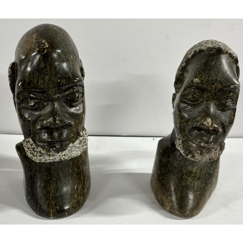 100 - Pair of Carved either stone or soapstone heads bears signature Emanuel MM to the base