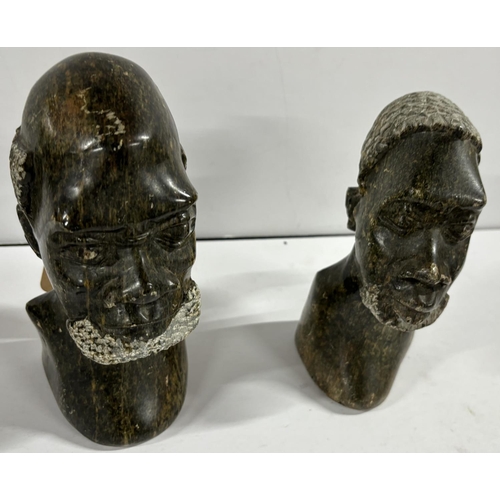 100 - Pair of Carved either stone or soapstone heads bears signature Emanuel MM to the base